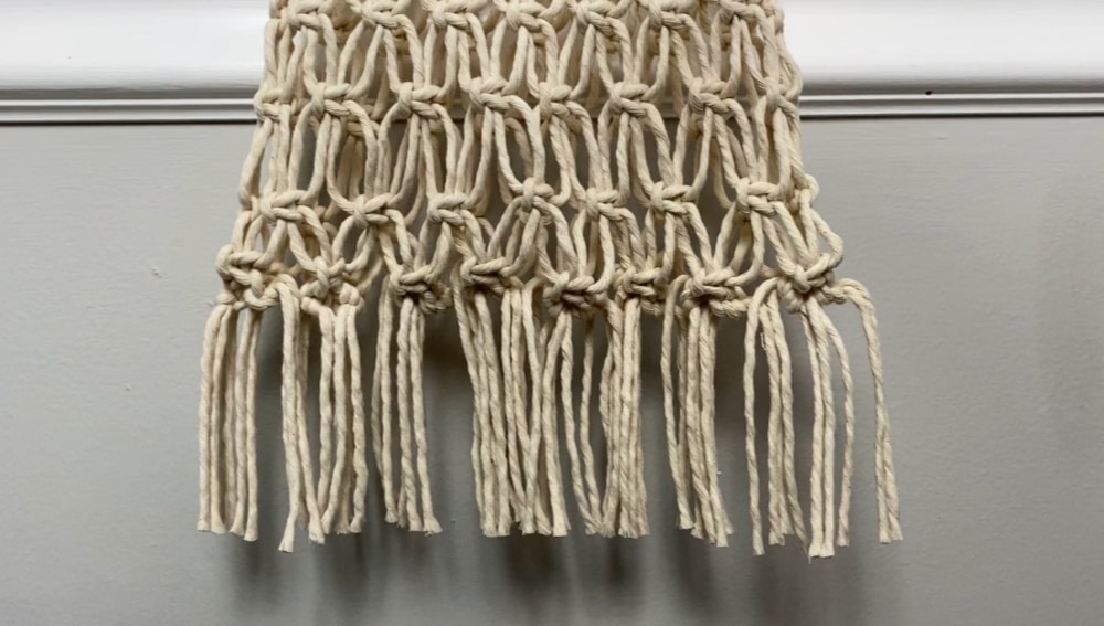 Knots tied all along the bottom of the bag