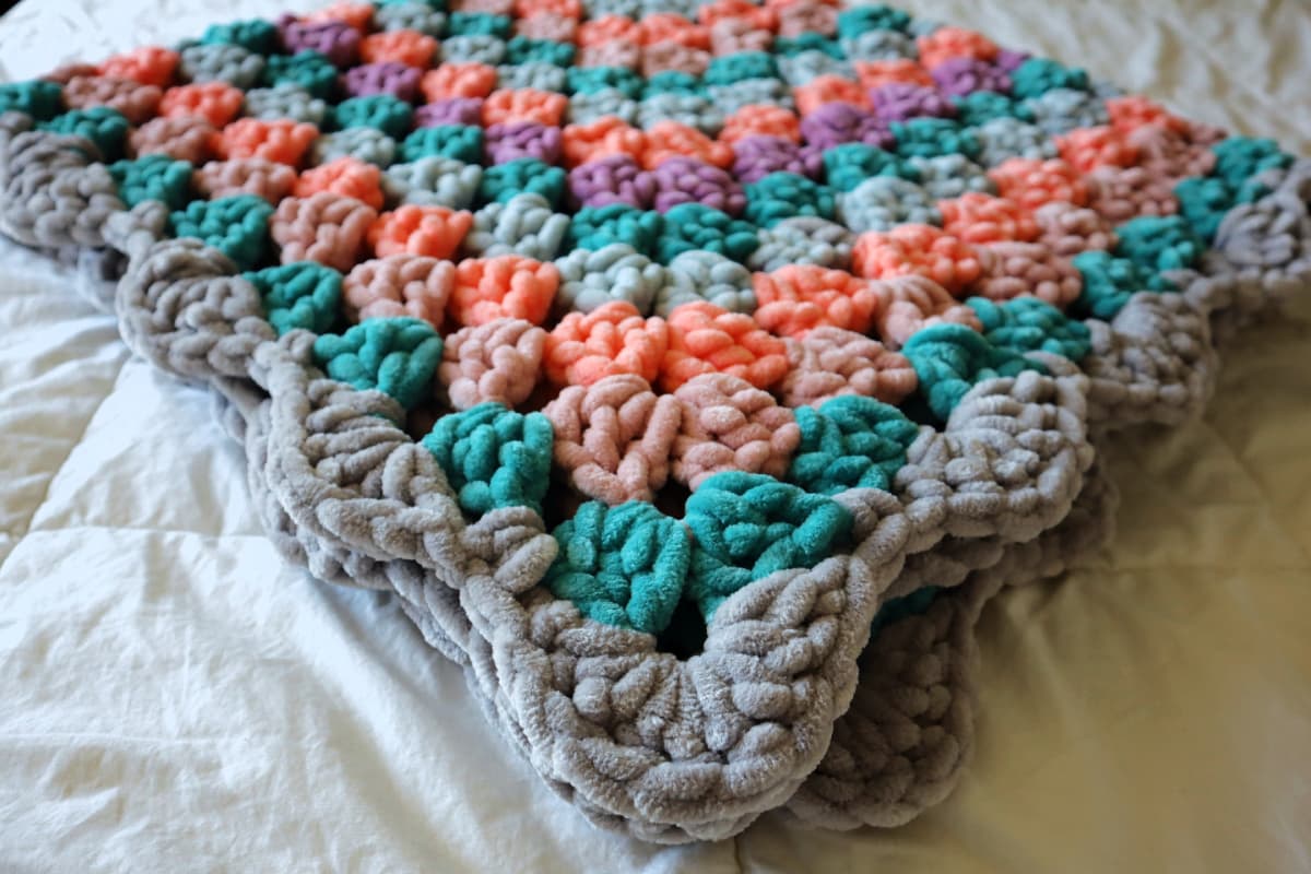 This Crochet Granny Squares Blanket is the Largest in the World, for now!   Crochet granny square blanket, Granny square blanket, Granny square crochet