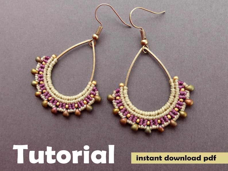 micro macrame teardrop shaped earrings laying on a table