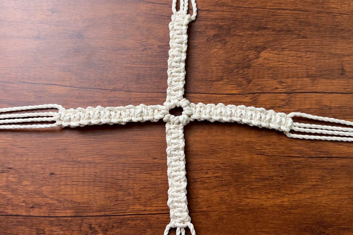 10 square knots done on each of the four arms