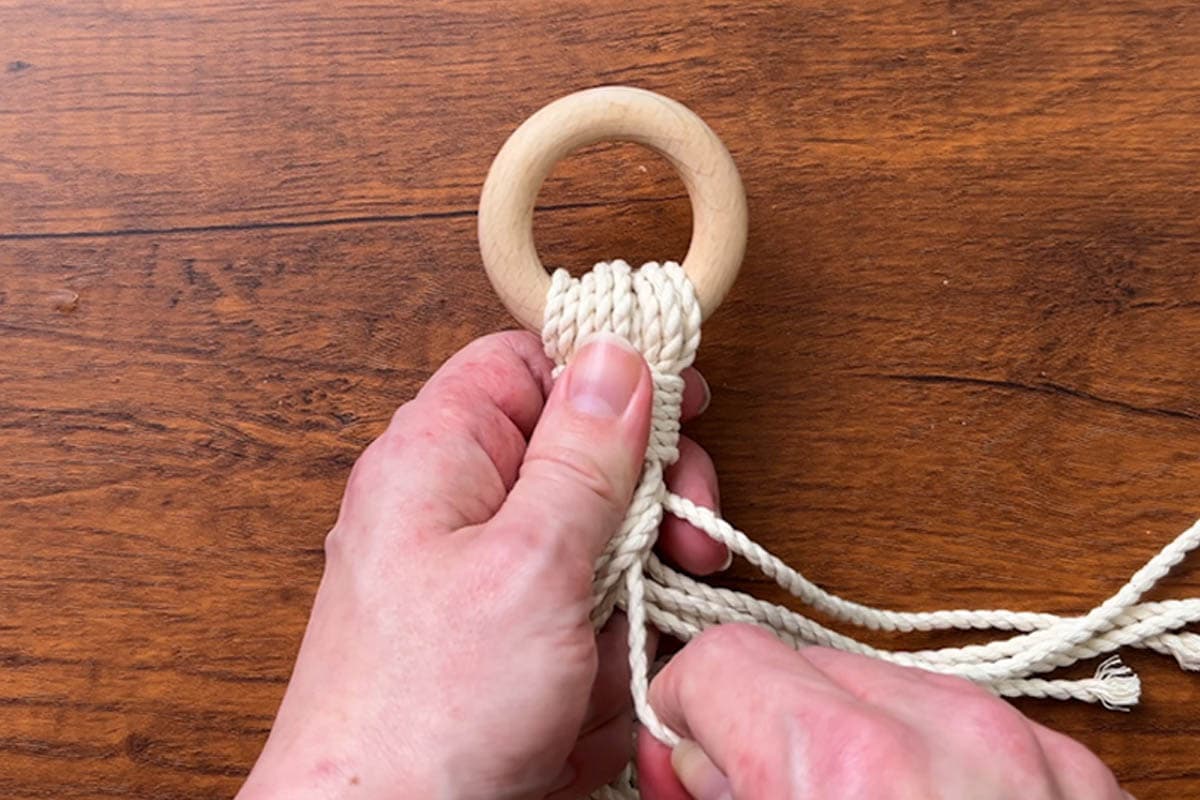 pulling the cords to remove any excess slack